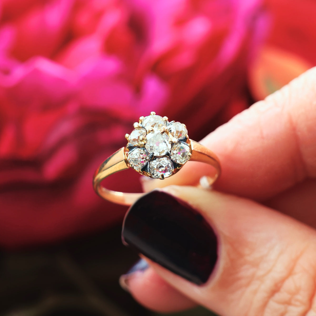 An Antique Hand Cut Diamond Cluster Engagement Ring