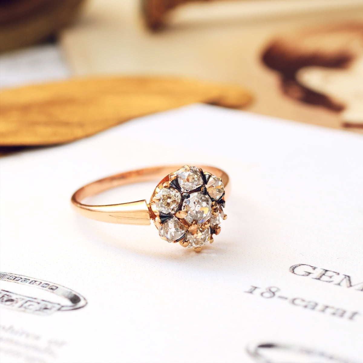 An Antique Hand Cut Diamond Cluster Engagement Ring