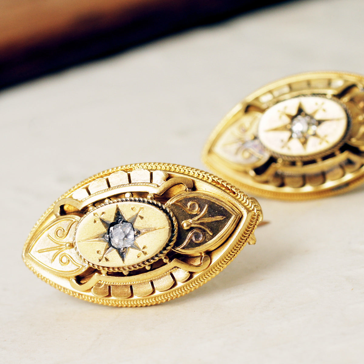 Pair of Antique Estrucan Inspired 18ct Diamond Brooches