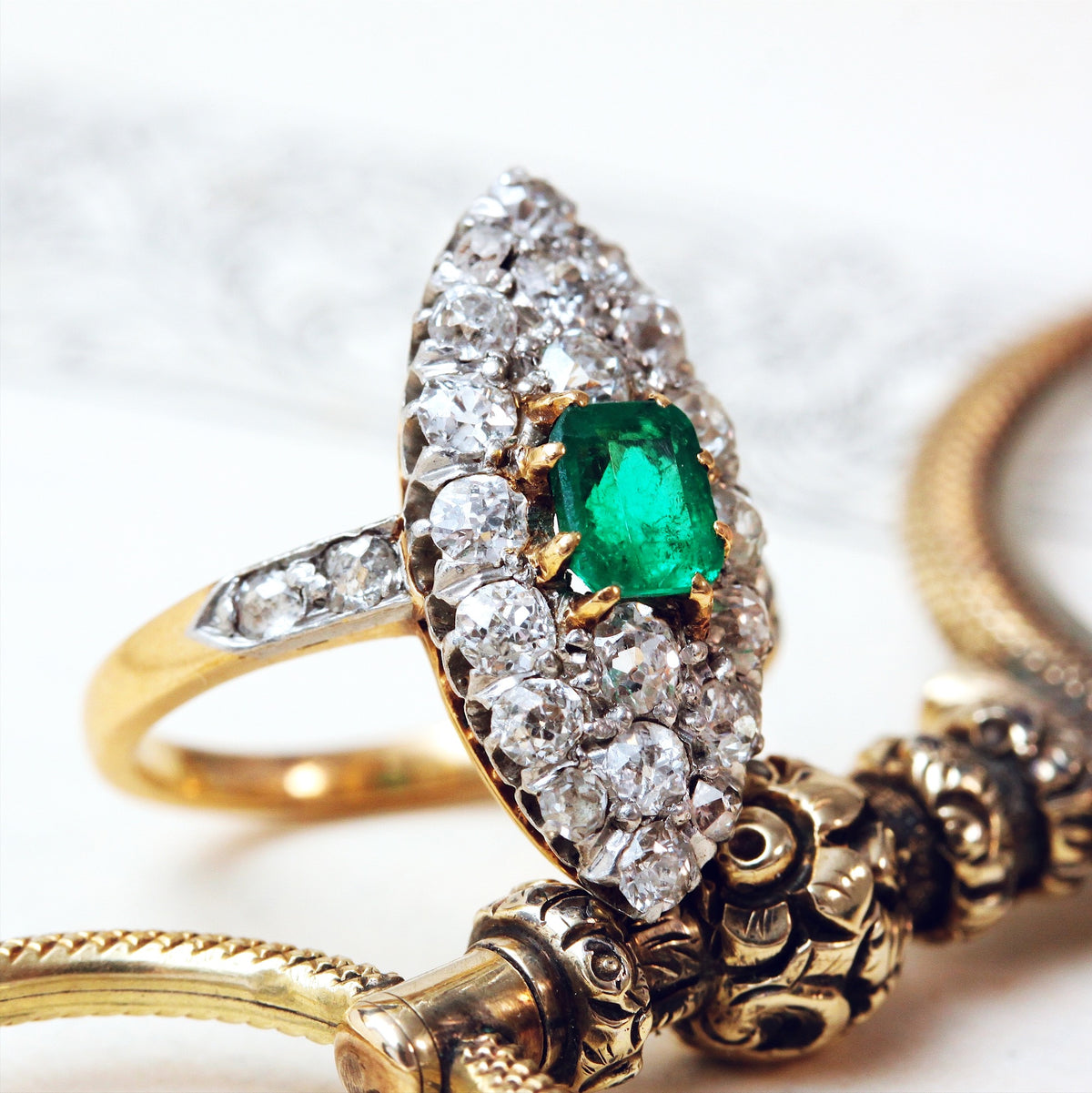 Edwardian Emerald and Diamond Navette Cluster Ring